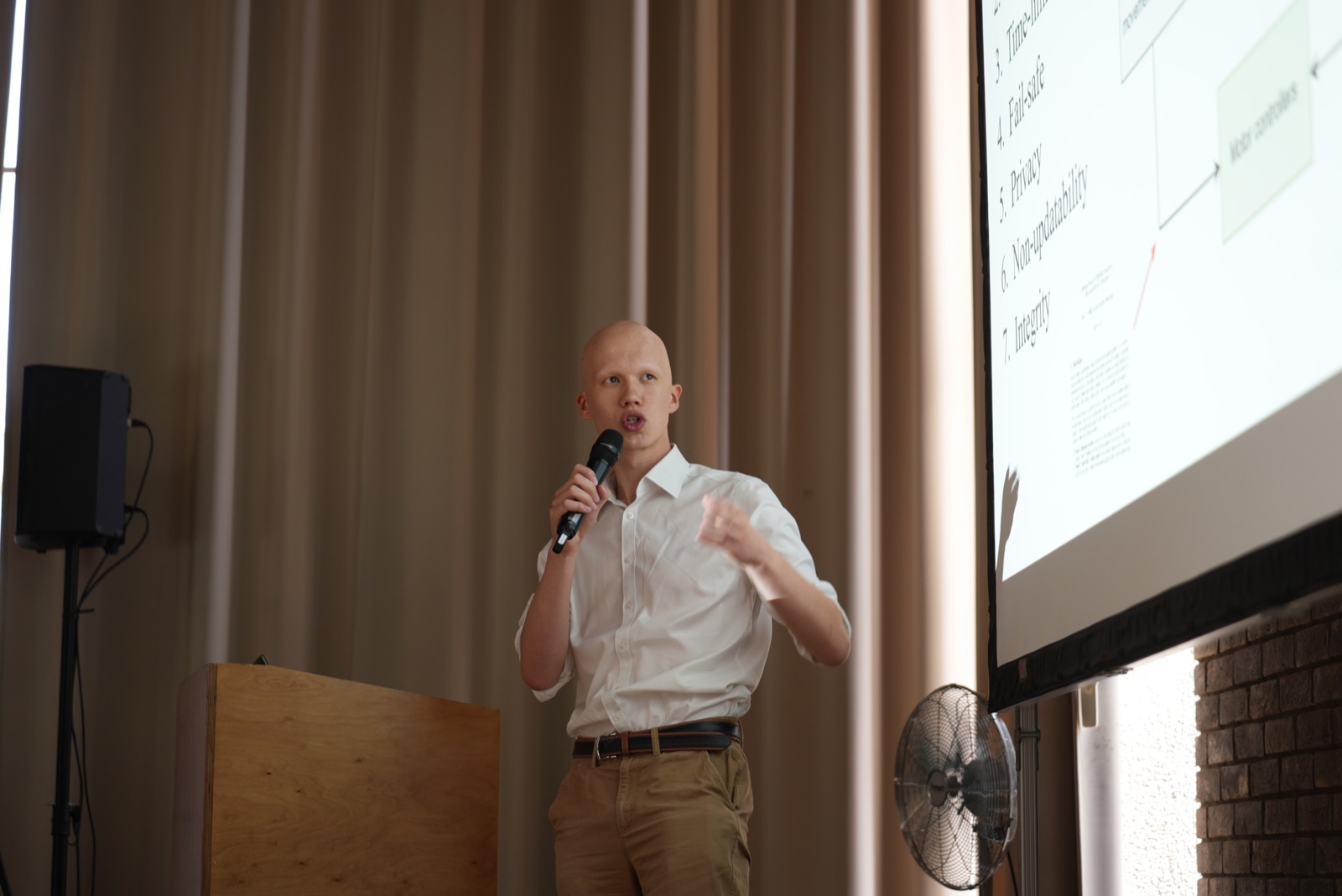 A participant presenting a final project at Churchill College