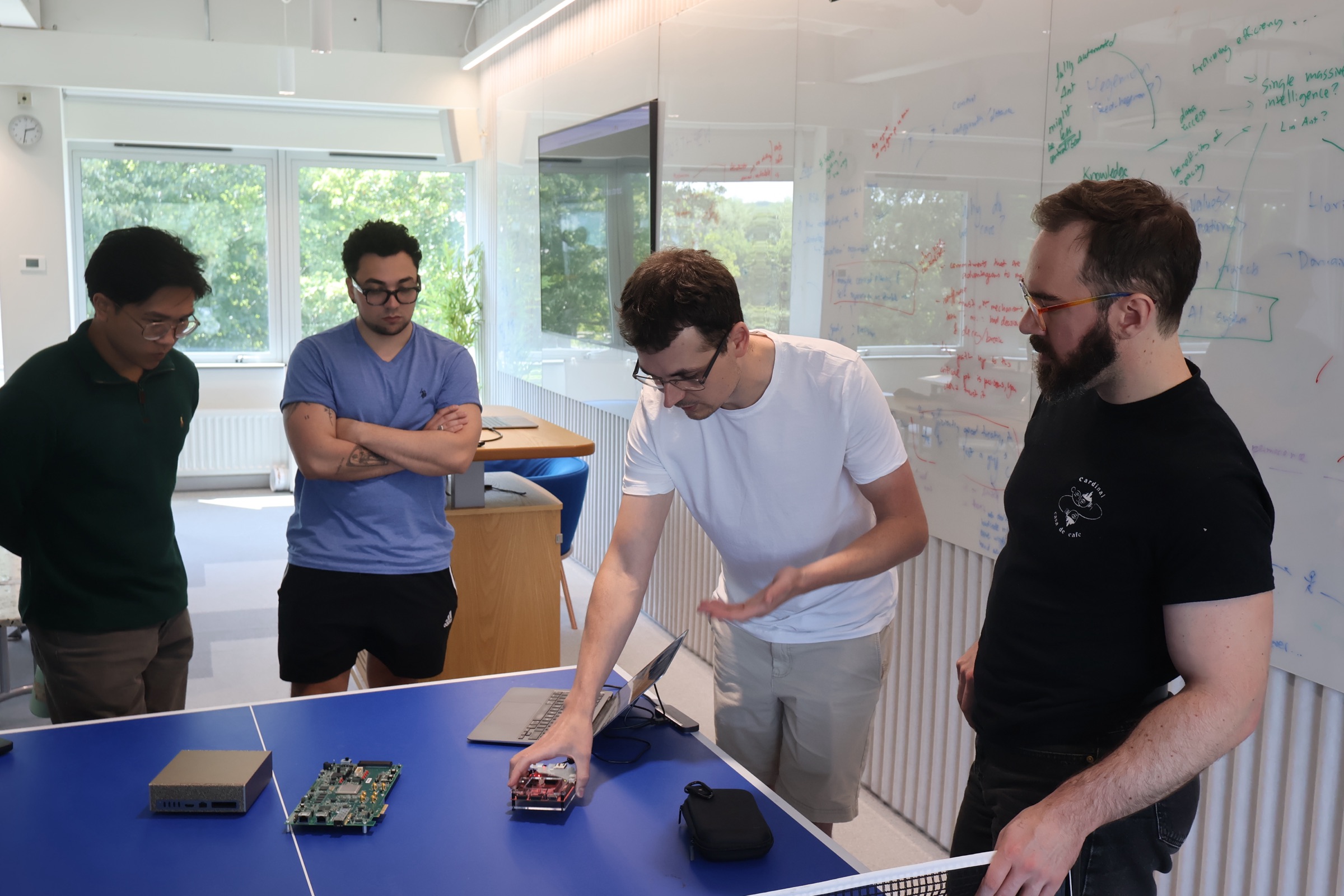 Participants demoing hardware verification work on a development board at Meridian